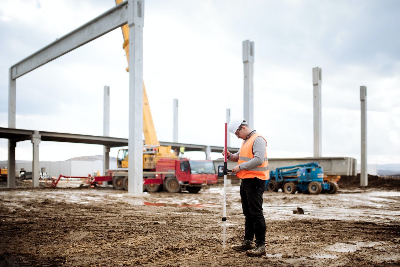 industrial civil engineer working with prefabricated cement pillars