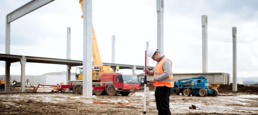 industrial civil engineer working with prefabricated cement pillars